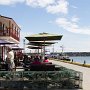 <p align="left">L'Anse à Beaufils. Tout n'est plus que restauration. Terrasse typiquement gaspésienne avec les cadges à homard et son décor naturel de petit port de pêche. Mais restauration tout de même. L'art et la culture relégués à l'étage.... désert.